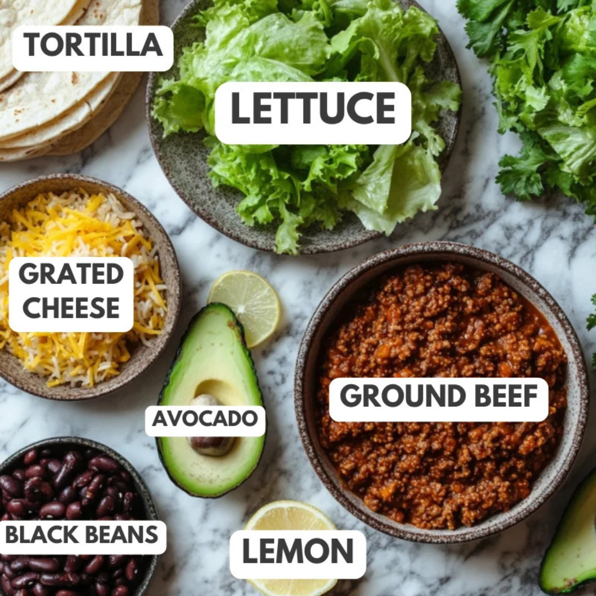 Tortilla, lettuce, grated cheese, avocado, black beans, lemon and ground beef.