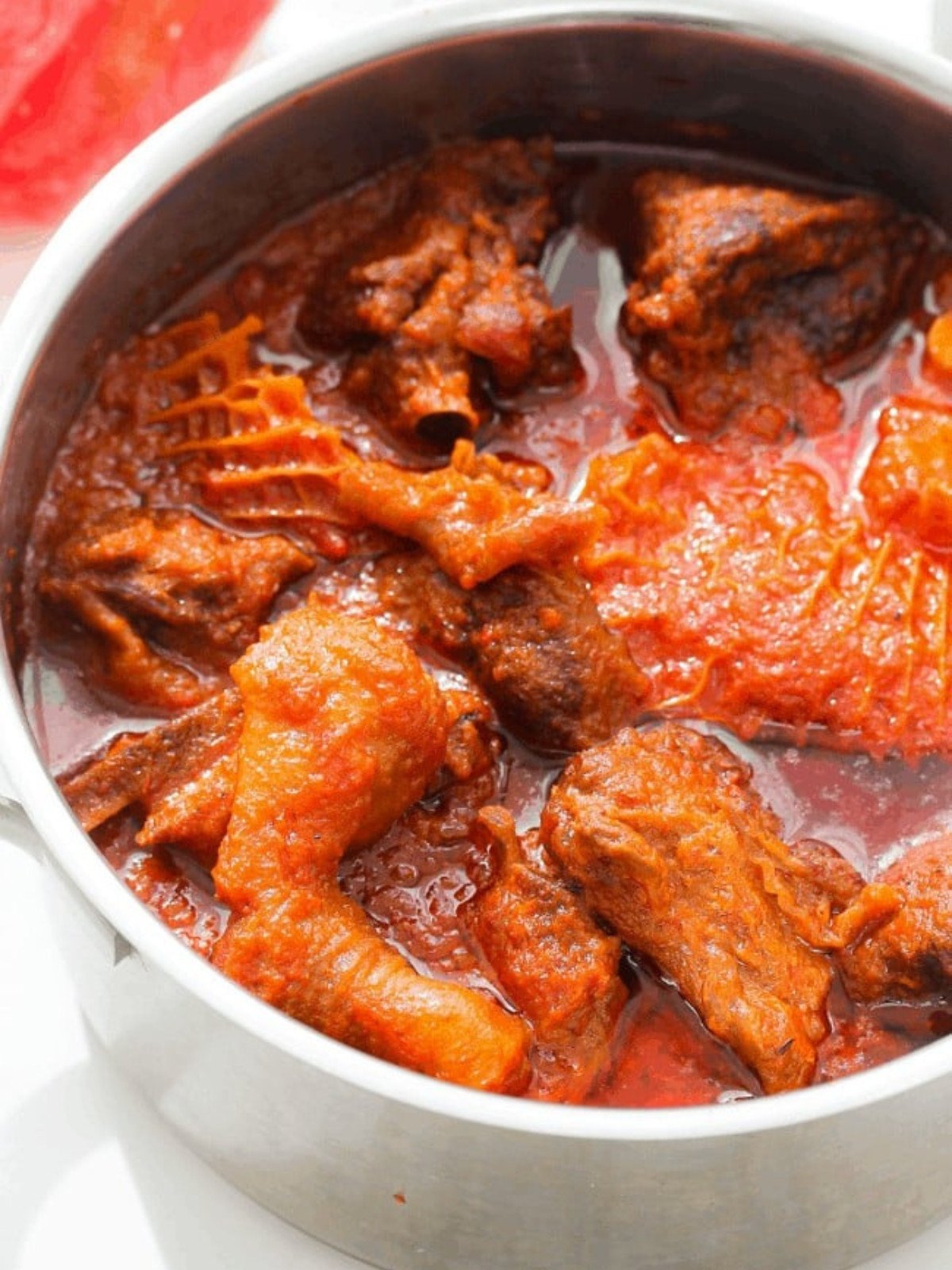 Nigerian red stew with chicken.