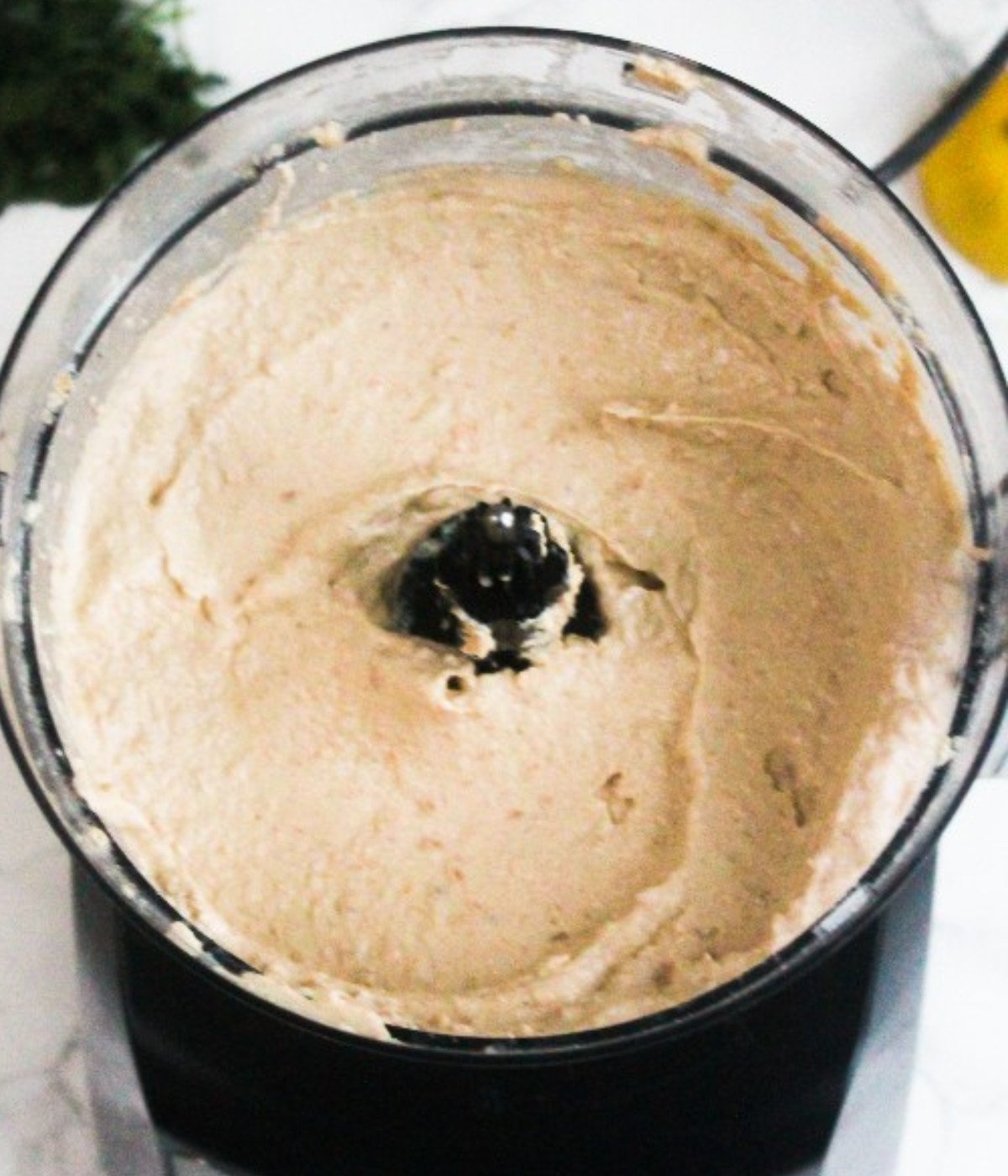 Hummus blended in a food processor.