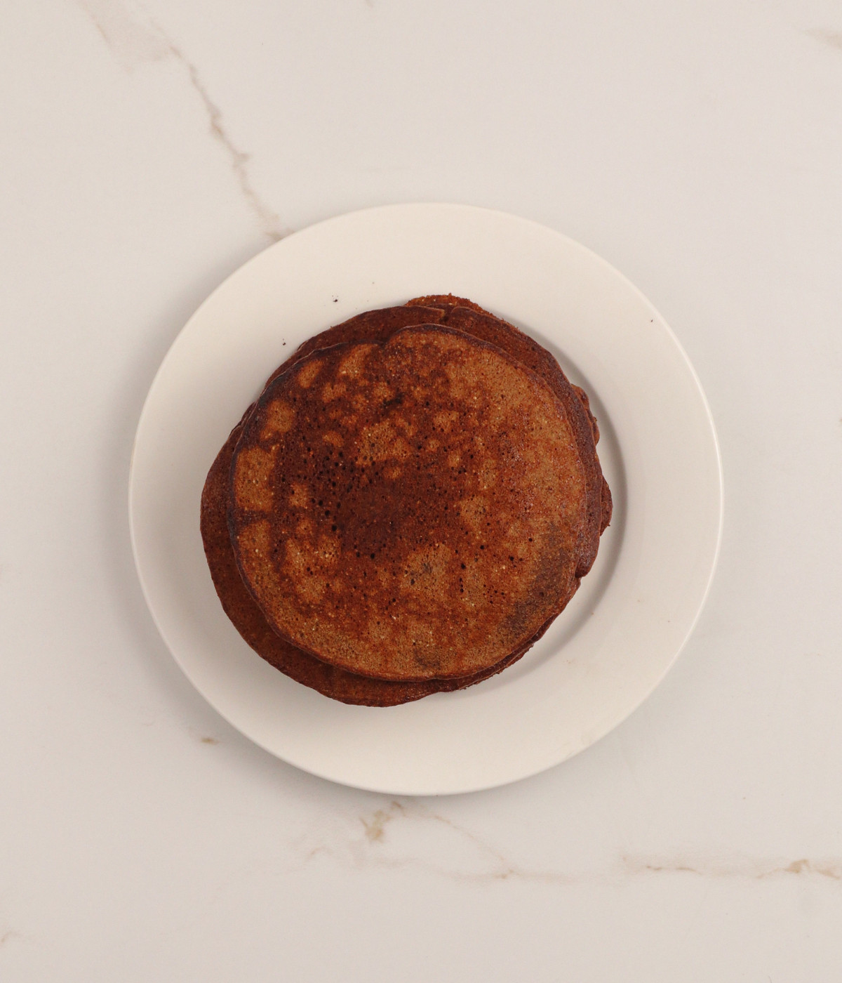 Chocolate pancake in a white plate.