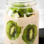 Oatmeal and kiwi in a glass jar.