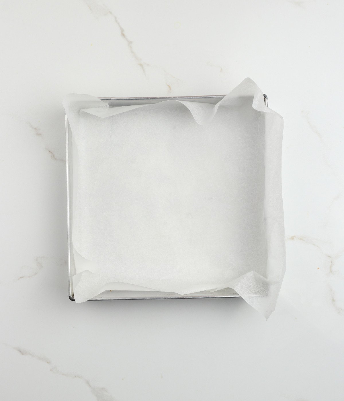 Lined square tin.