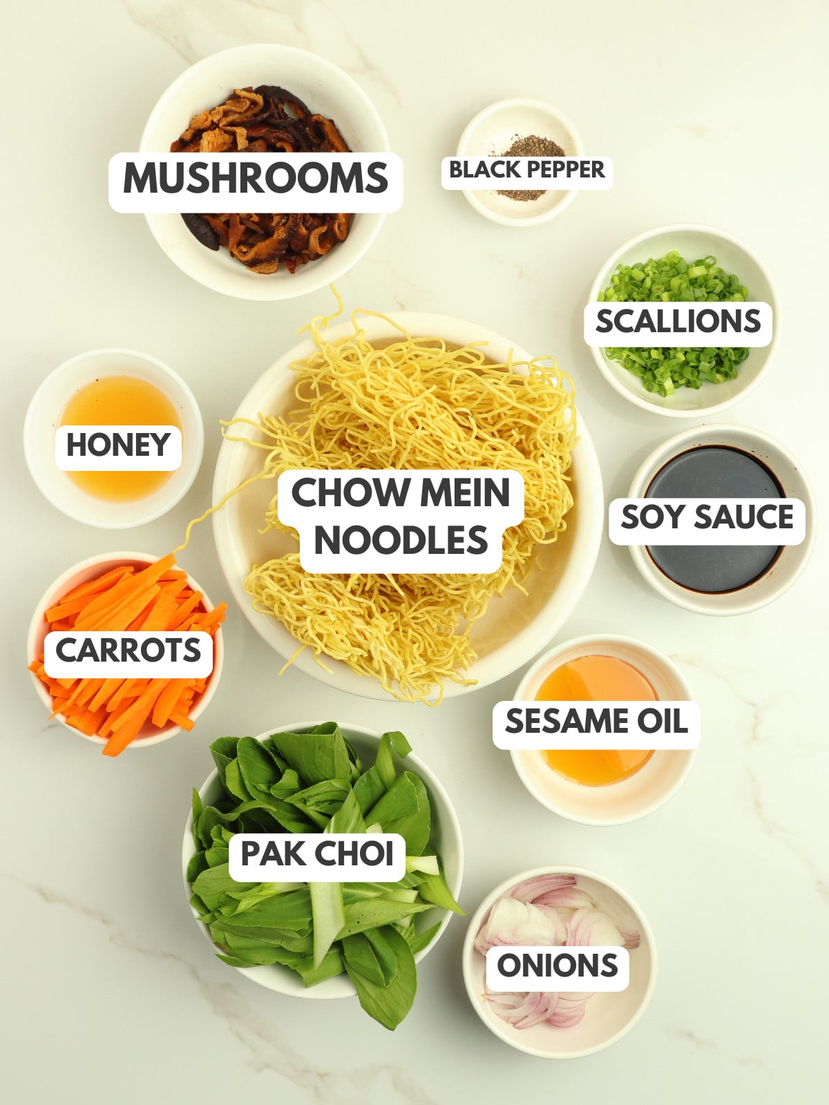 Mushrooms, black pepper, scallions, chow mein noodles, honey, soy sauce, pak choi, carrots, sesame oil and onions.