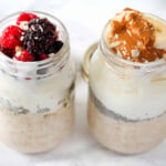 Oat, yogurt, berries, nut butter and banana slices in a jar