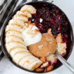 Chopped banana, yoghurt, mixed berry sauce, nut butter and almonds.
