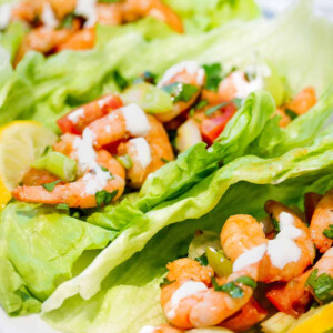 Prawn in lettuce wraps with sour cream.