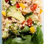 Quinoa, broccoli, tomato, cannoli, spinach and yellow capsicum peppers.