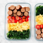 Sausage, tomato, egg and kale in a meal prep bowl.