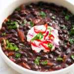 Stewed black beans and sour cream.