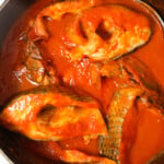 Tomato fish stew cooked in a pot.