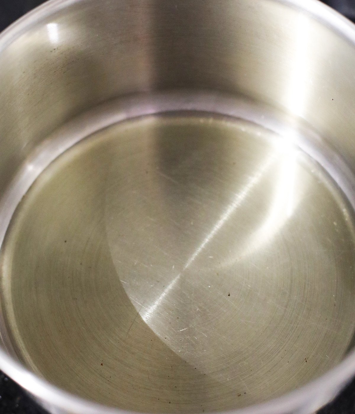 Vegetable oil in a silver pot.