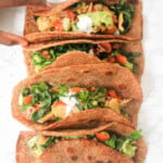 Whole meal tacos with chicken and salad.