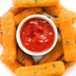 Cheese sticks with ketchup in the middle.