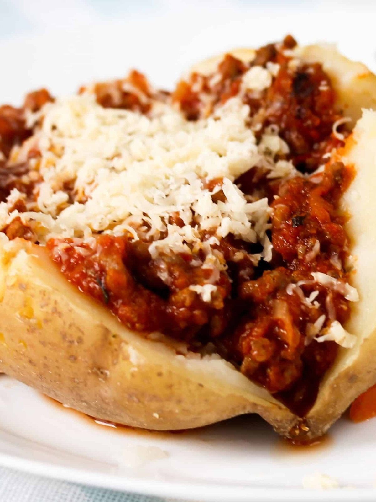 Jacket potato stuffed with ground beef and cheese.