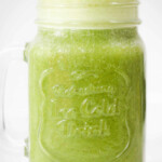 Matcha-flavored milk mixture in a glass jar.