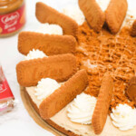 Biscoff cheesecake on a white table.