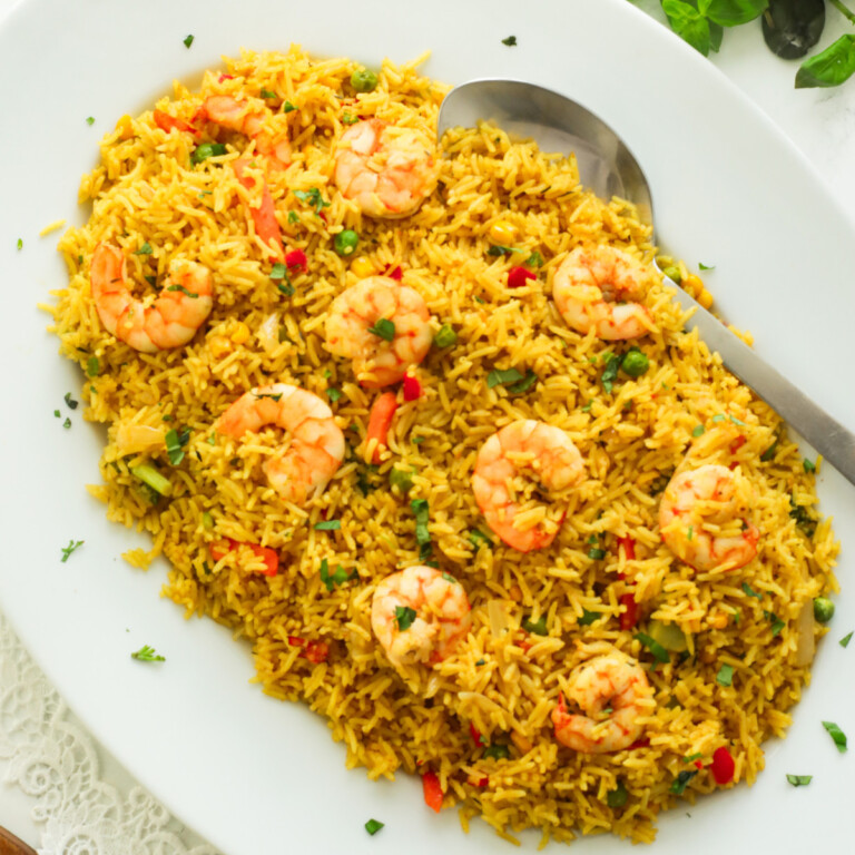 Nigerian-style fried rice on a white plate.