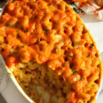 Pumpkin macaroni topped with chives.