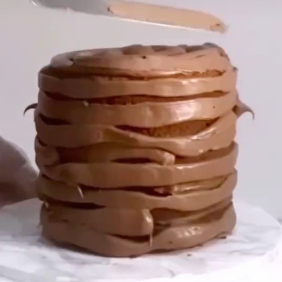 Chocolate ferrero cake frosted with milk chocolate ganache.