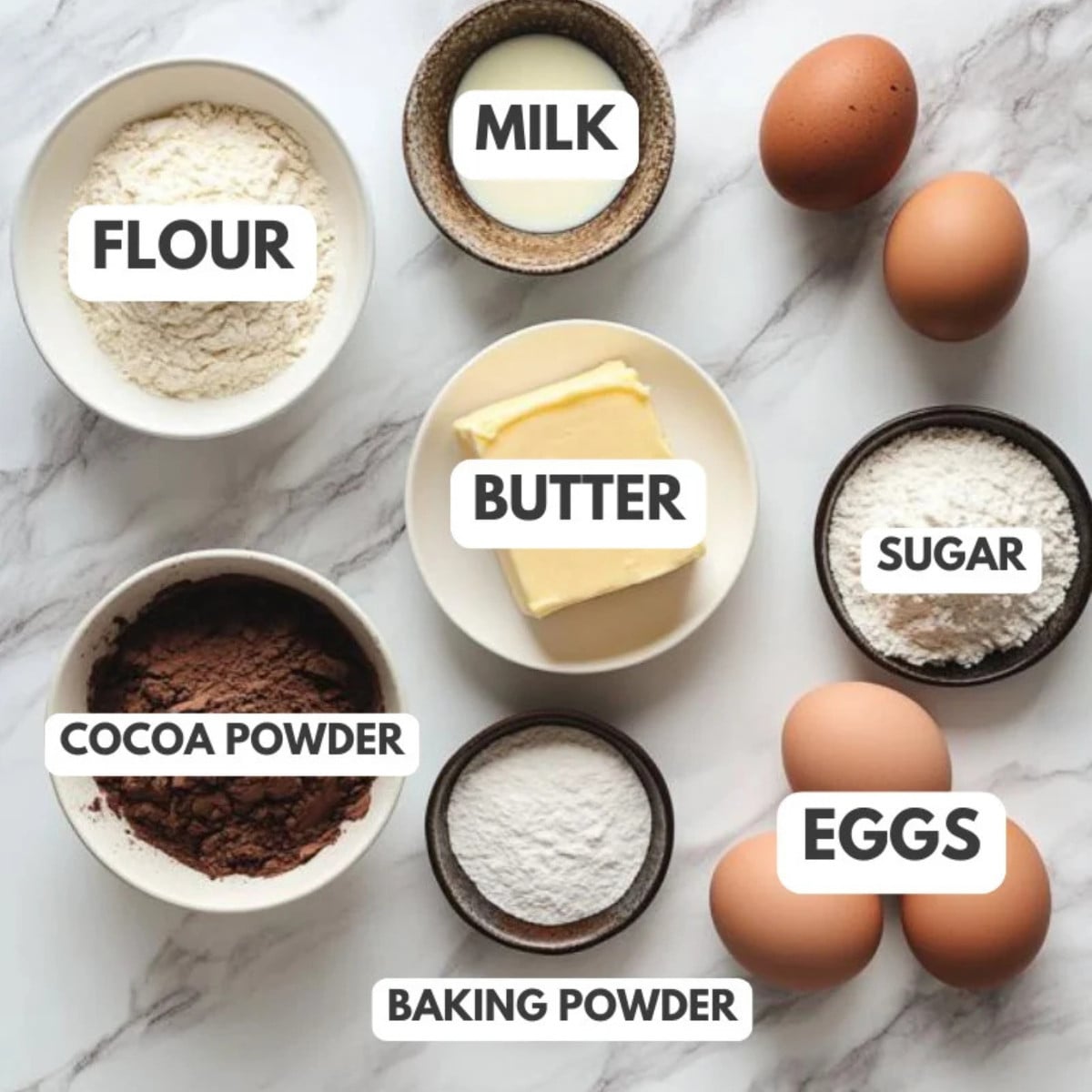 Flour, milk, eggs, butter, cocoa powder, baking powder and sugar.