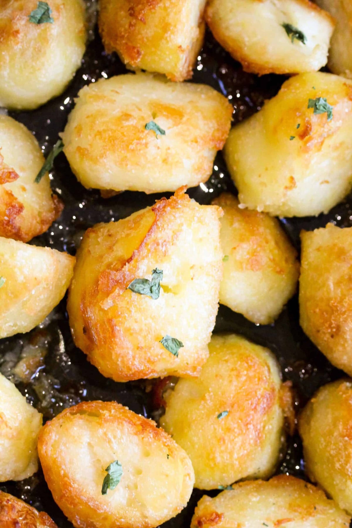 Roast potatoes with herbs on top.
