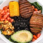 Black beans, hasselback potaoes, corn, cauliflower, tomatoes and spinach.