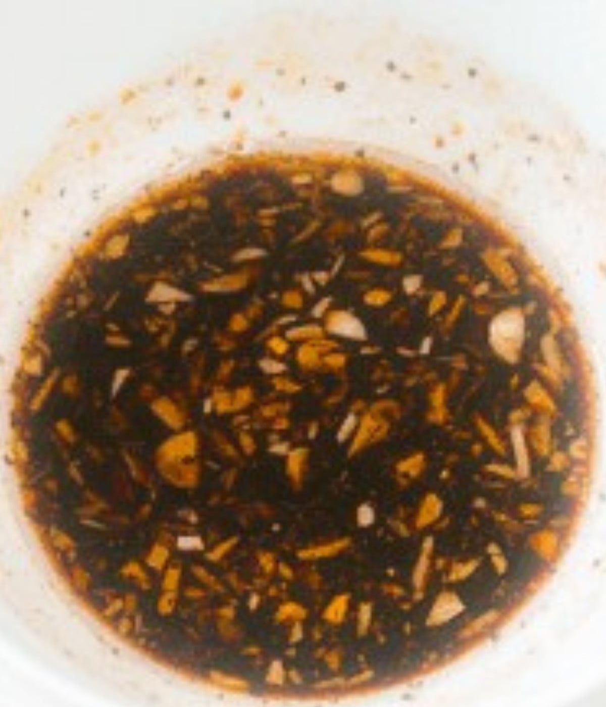 Honey soy marinade in a white bowl.
