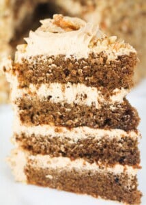 a slice of four layer coffee and walnut cake