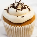 Irish cream cupcakes with chocolate sprinkles on top.