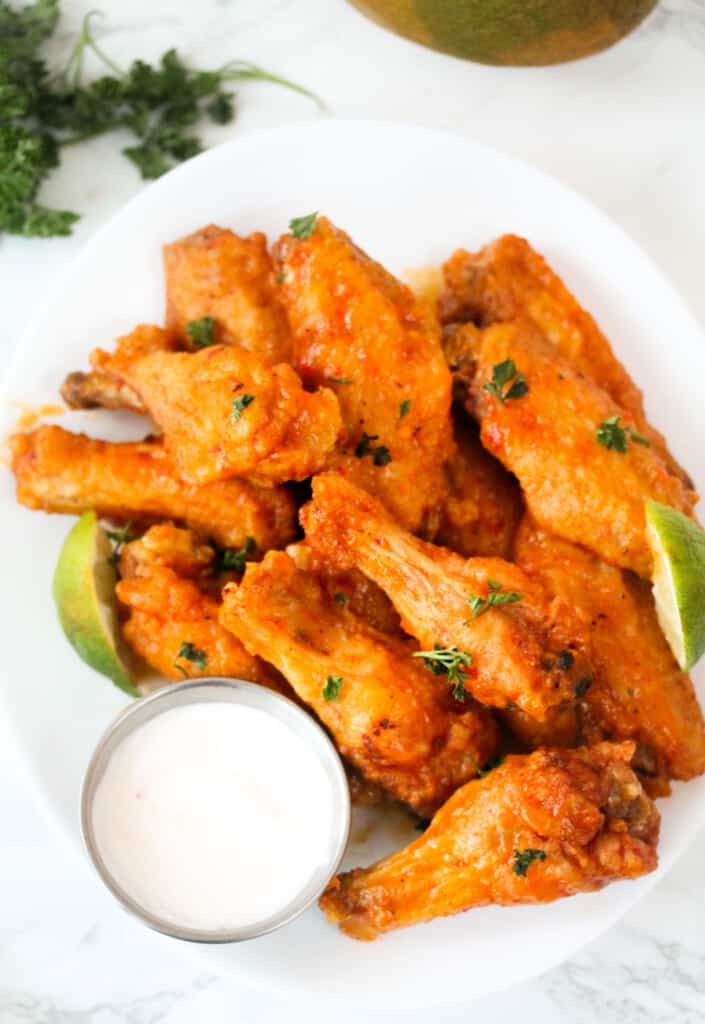 Spicy mango wings with sour cream