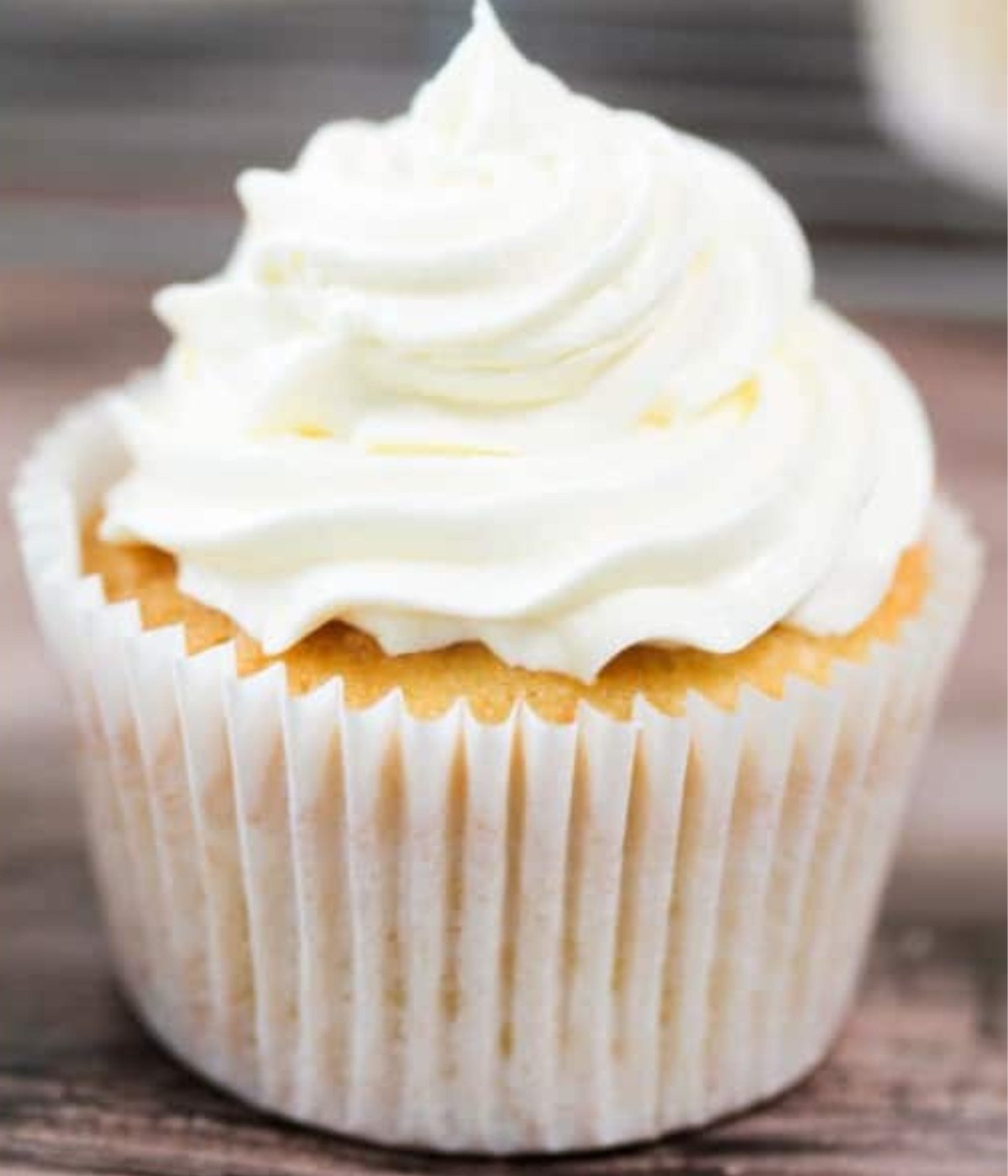 Coconut buttercream on top of vanilla cupcakes.
