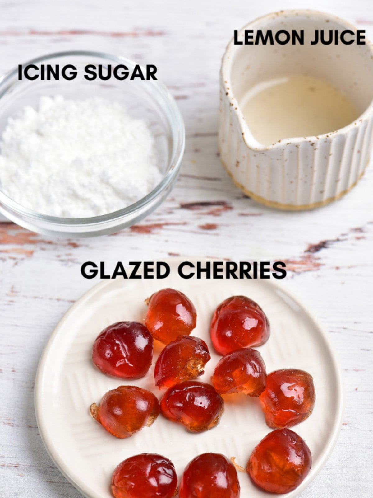 Icing sugar, lemon juice and red cherries.