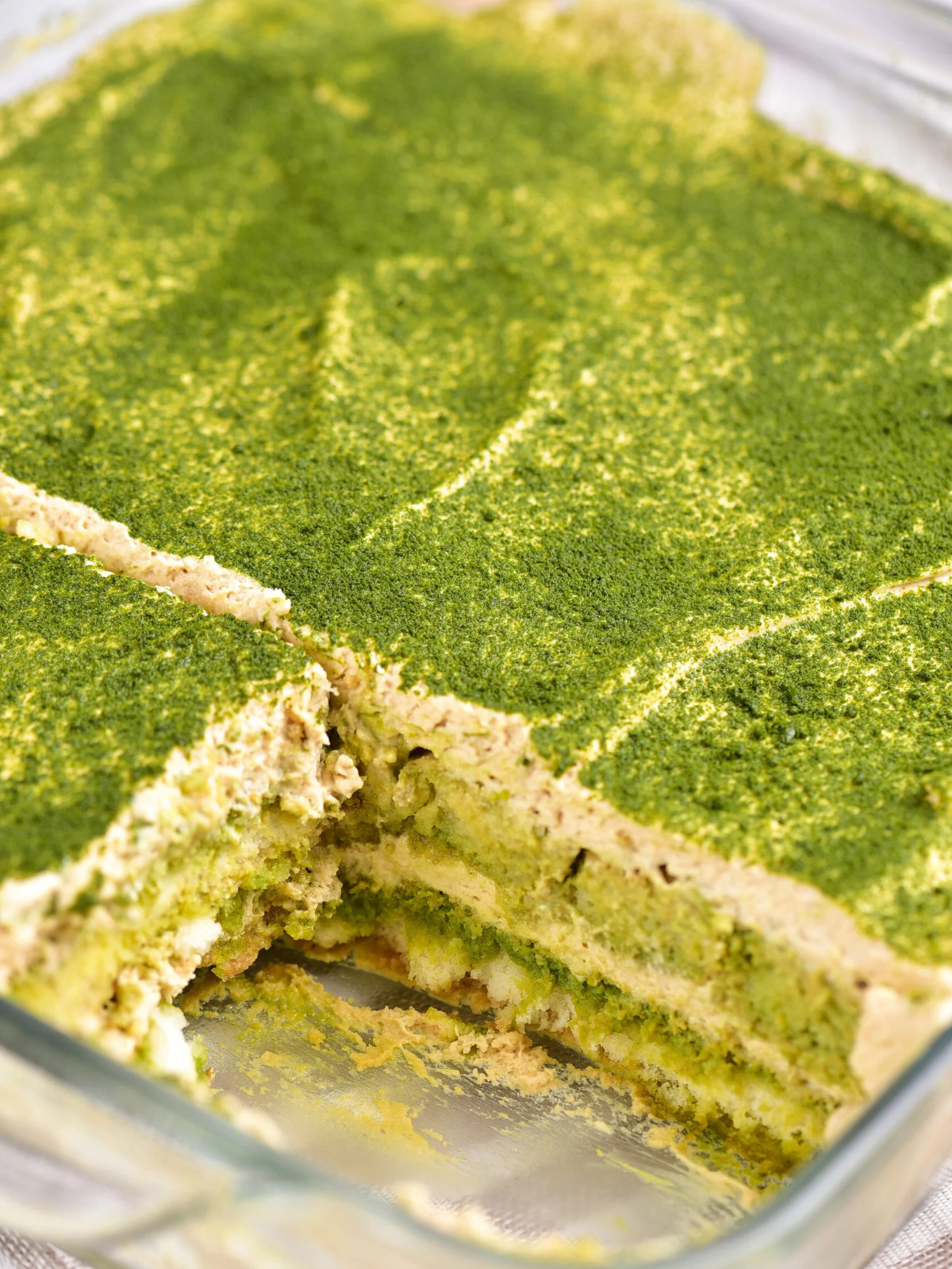 matcha tiramisus dessert in a glass dish.