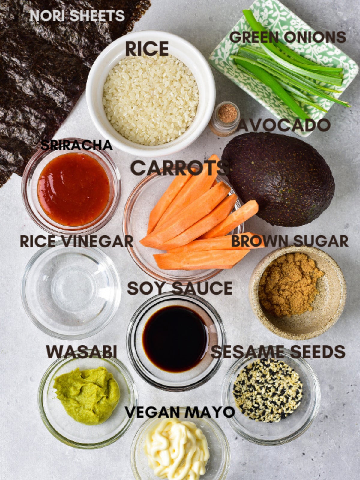 Nori sheets, rice, green onions, sriracha, carrots, avocado, sugar, vinegar, soy sauce, wasabi and sesame seeds.
