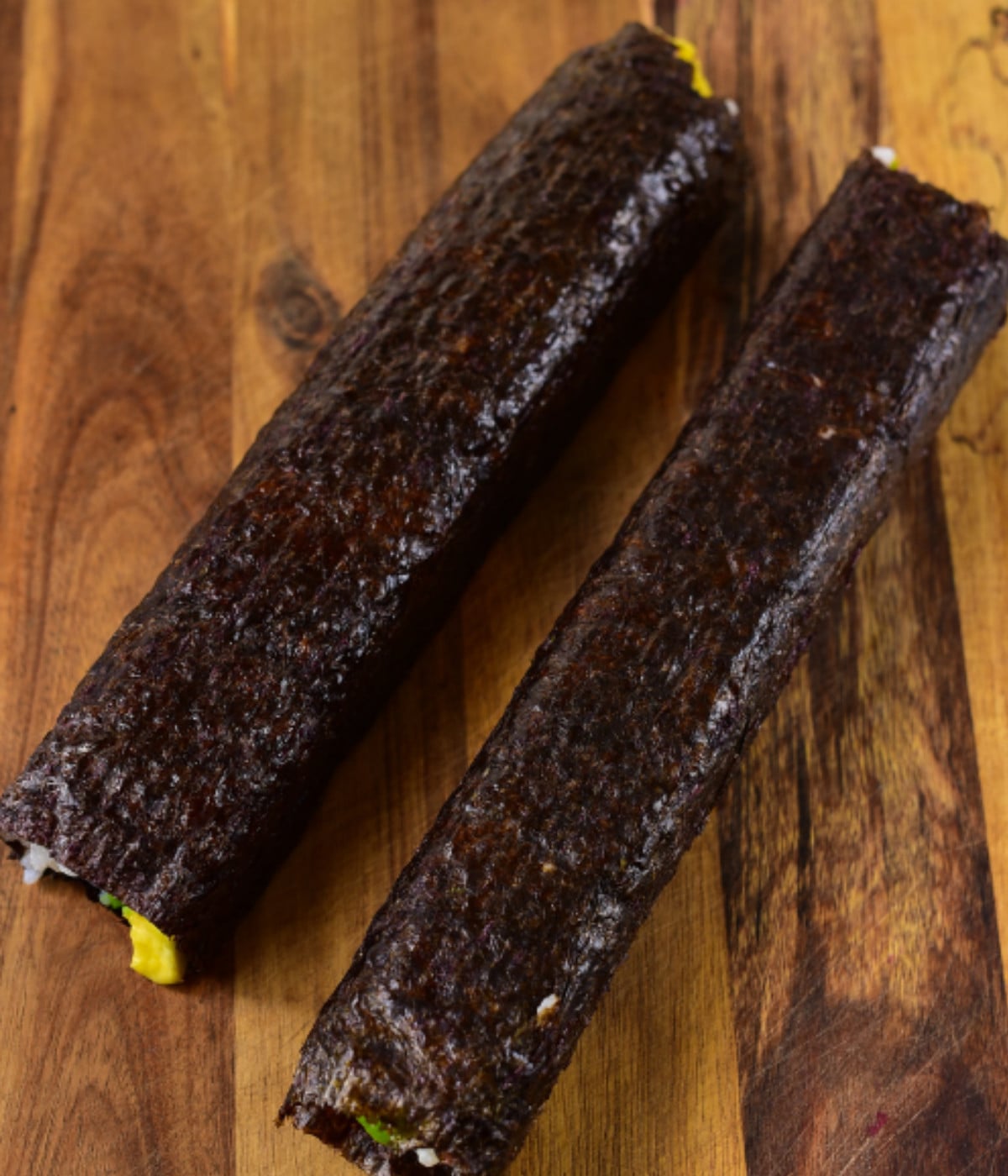 Rolled seaweed, white rice and sesame seeds, sweet potato and avocado.