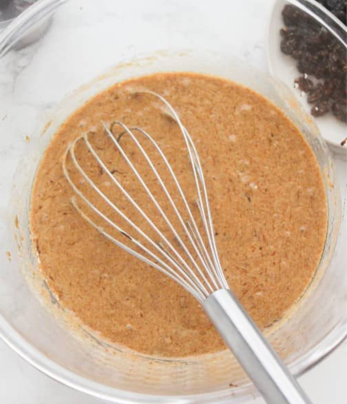 Whisked honey, Guinness, molasses, browning, melted butter, brown sugar and vanilla essence in a glass bowl.