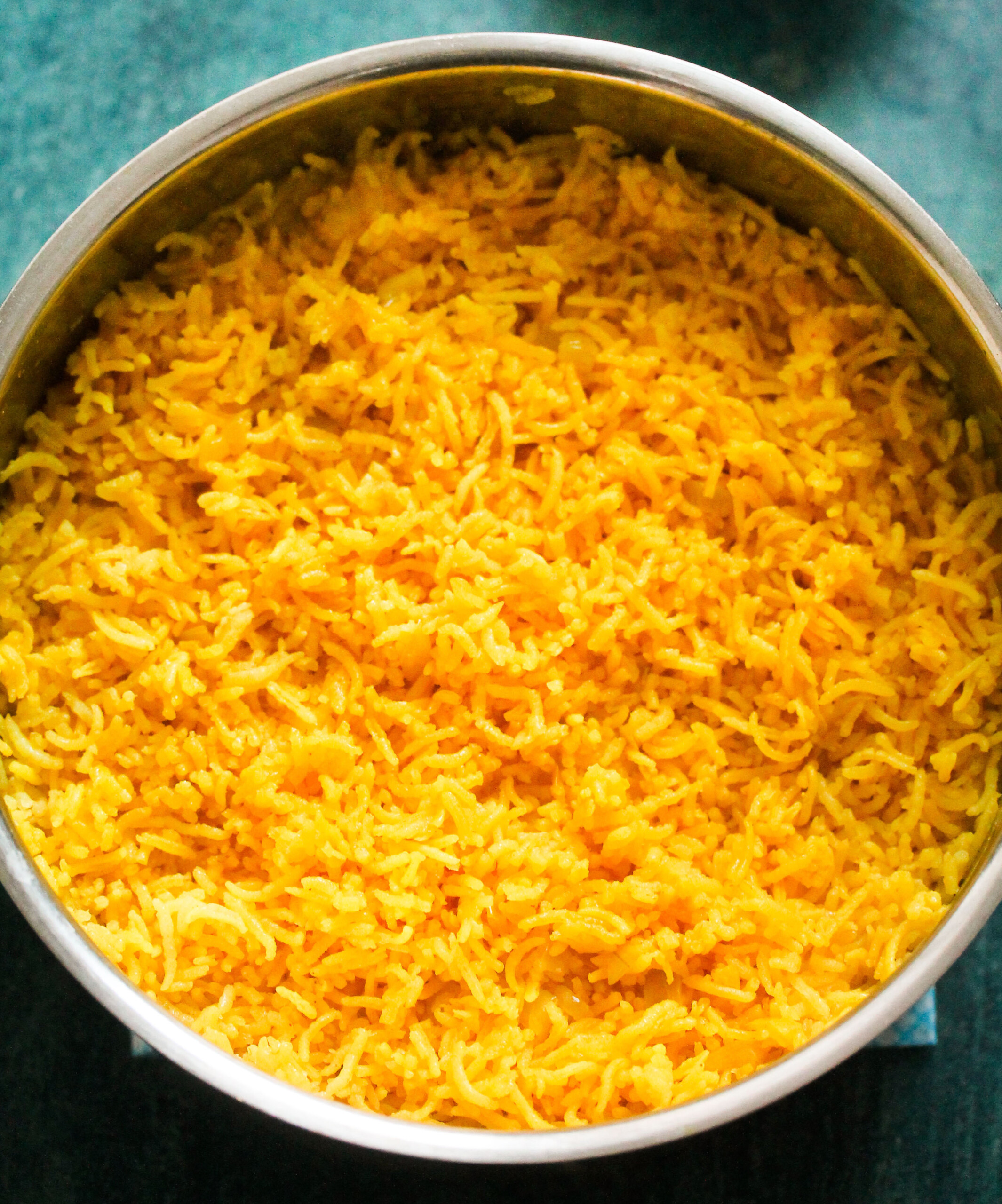 Cooked yellow rice in a pot.