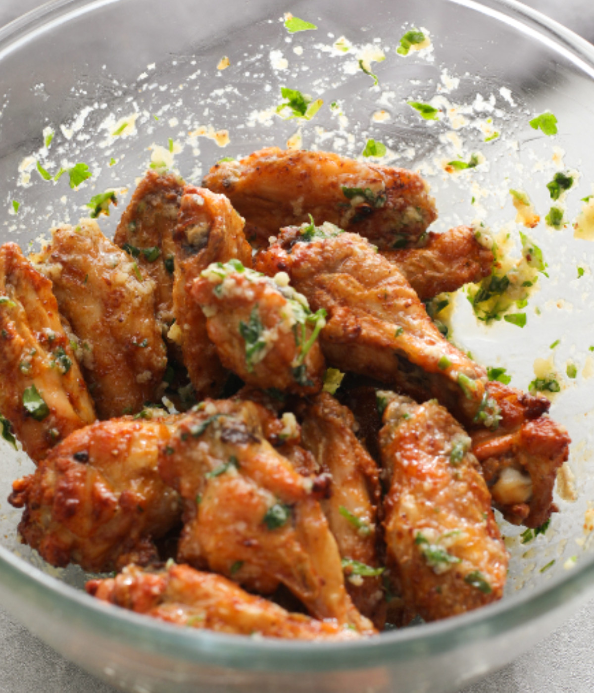 Baked crispy chicken wings coated in cheese, garlic and butter sauce.