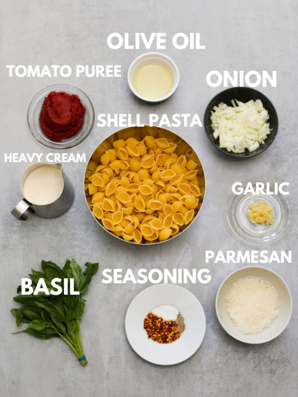 Tomato puree, olive oil, onion, shell pasta, seasoning, heavy cream, basil, vodka and parmesan.