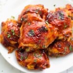 sticky bbq thighs on a plate.