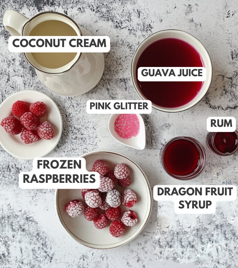 Coconut cream, pink glitter, guava juice, rum, dragon fruit syrup and frozen raspberries.