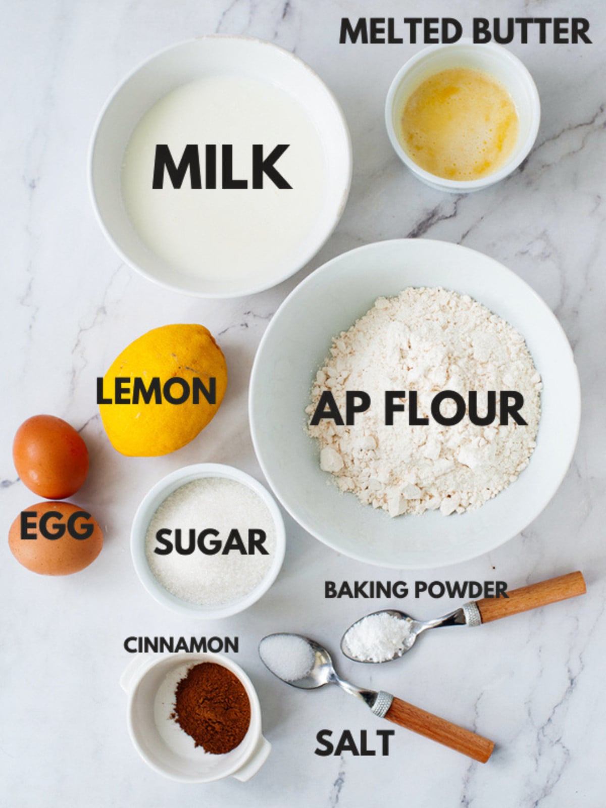 Flour, butter, eggs, sugar, lemon, milk, cinnamon and baking powder.