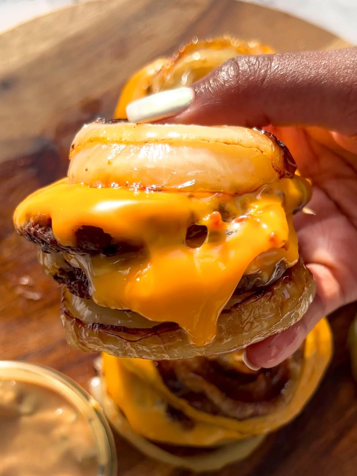 Onion wrapped flying dutchman burger with cheese.