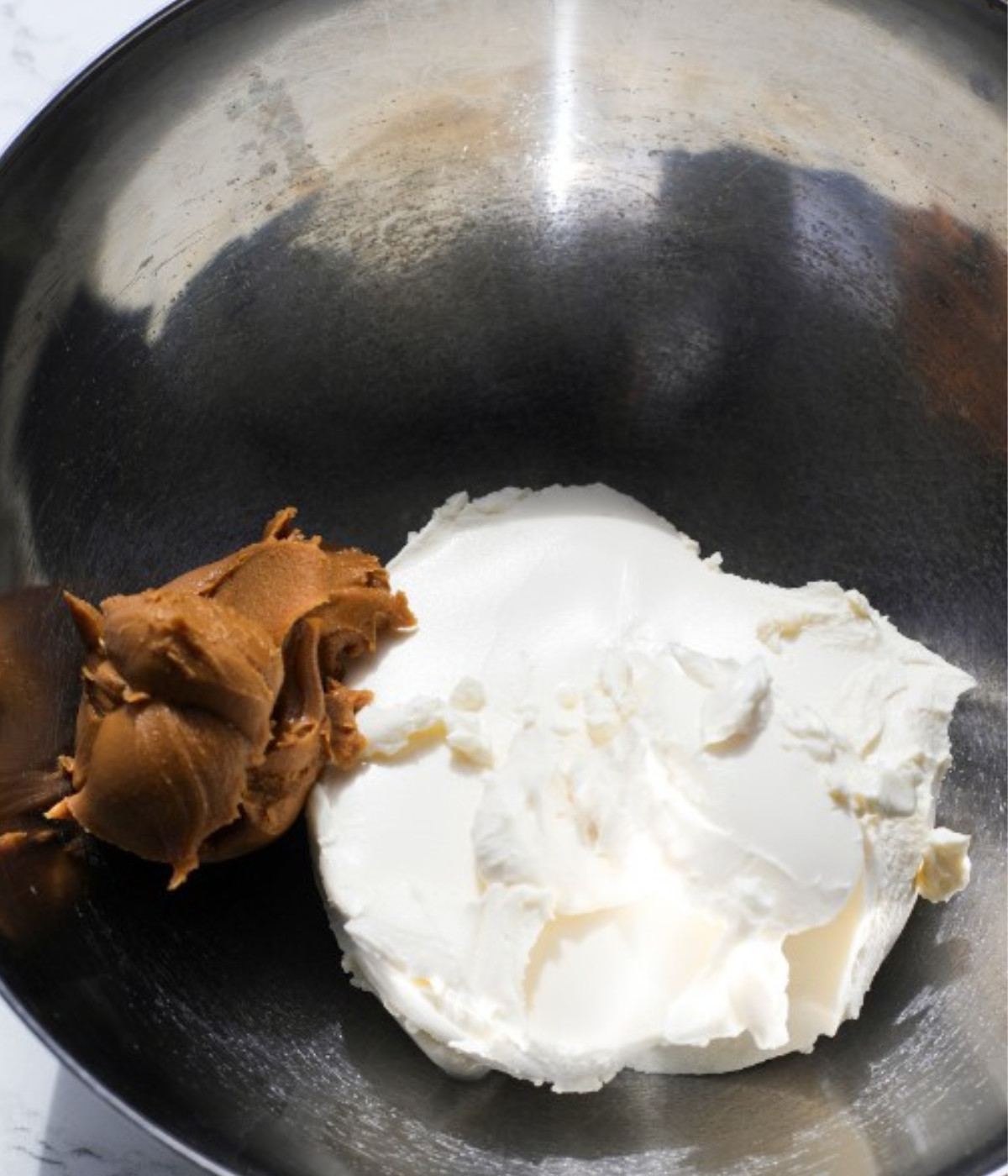 Cream cheese lotus biscoff and cream cheese in a silver.