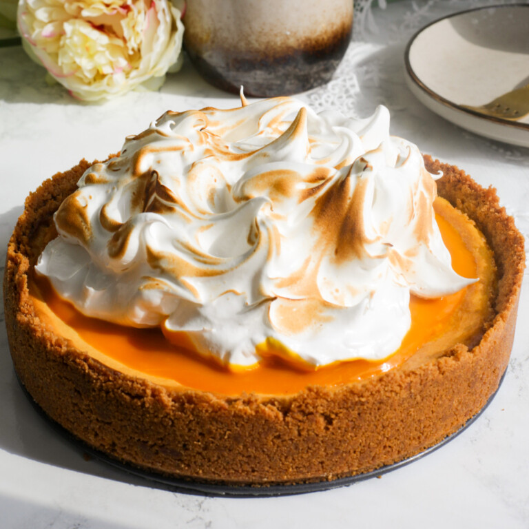 Baked mango-flavored cheese cake with torched meringu on top.