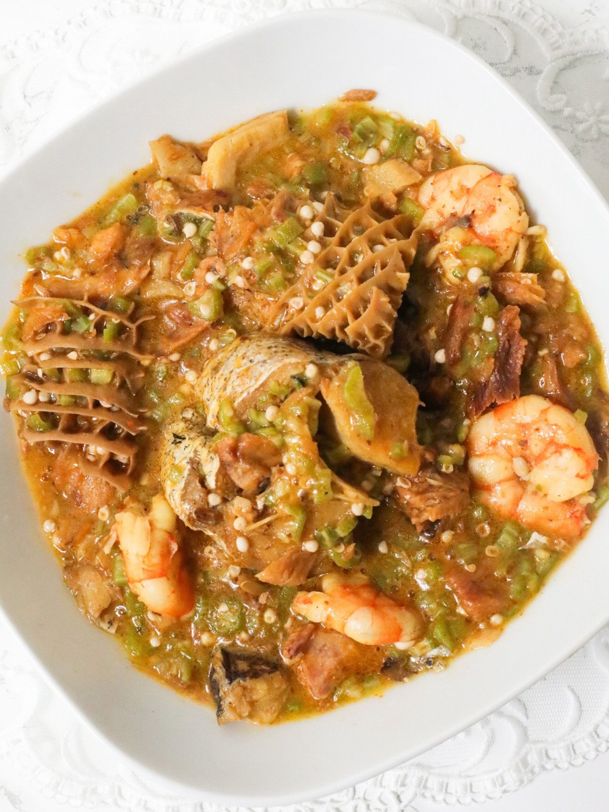 Nigerian okra soup in a white bowl.