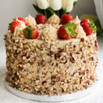 Hazelnuts coffee cake topped with strawberries.