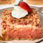 Strawberry crunch cake piece on a plate.