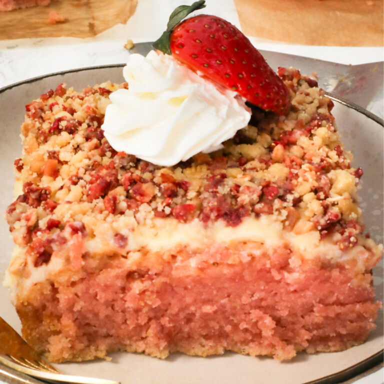 Strawberry crunch cake piece on a plate.