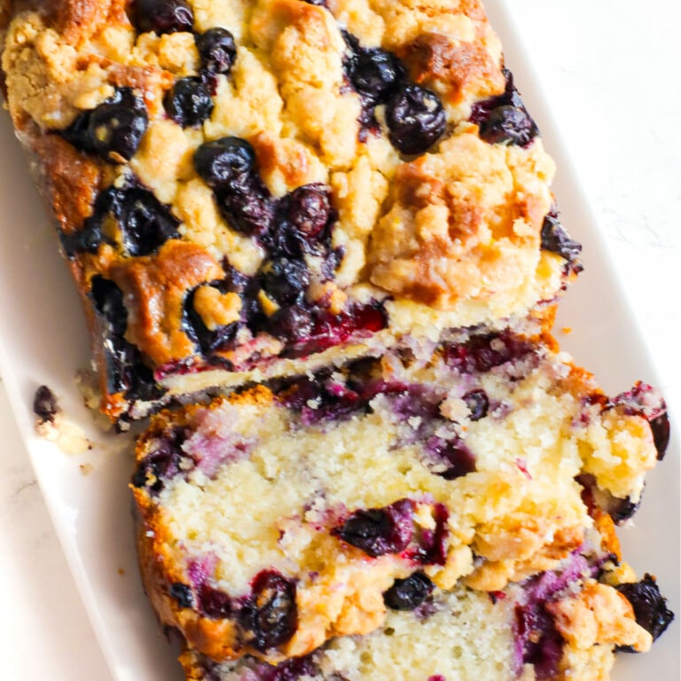 Lemon blueberry bread on a white plate.